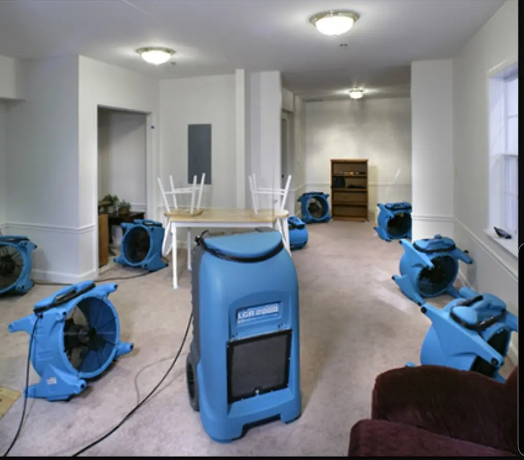 Air movers and dehumidifier setup for Water Damage Restoration in Rainsville
